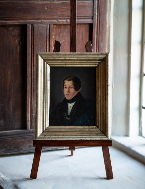 Portrait painting on easel