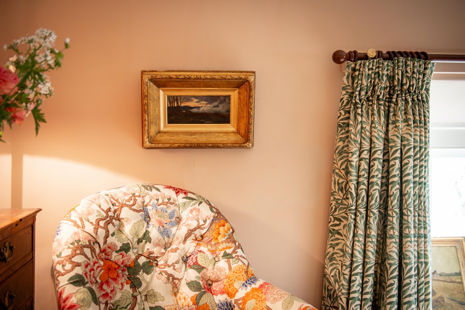 Impressionist artwork hung in an interior setting