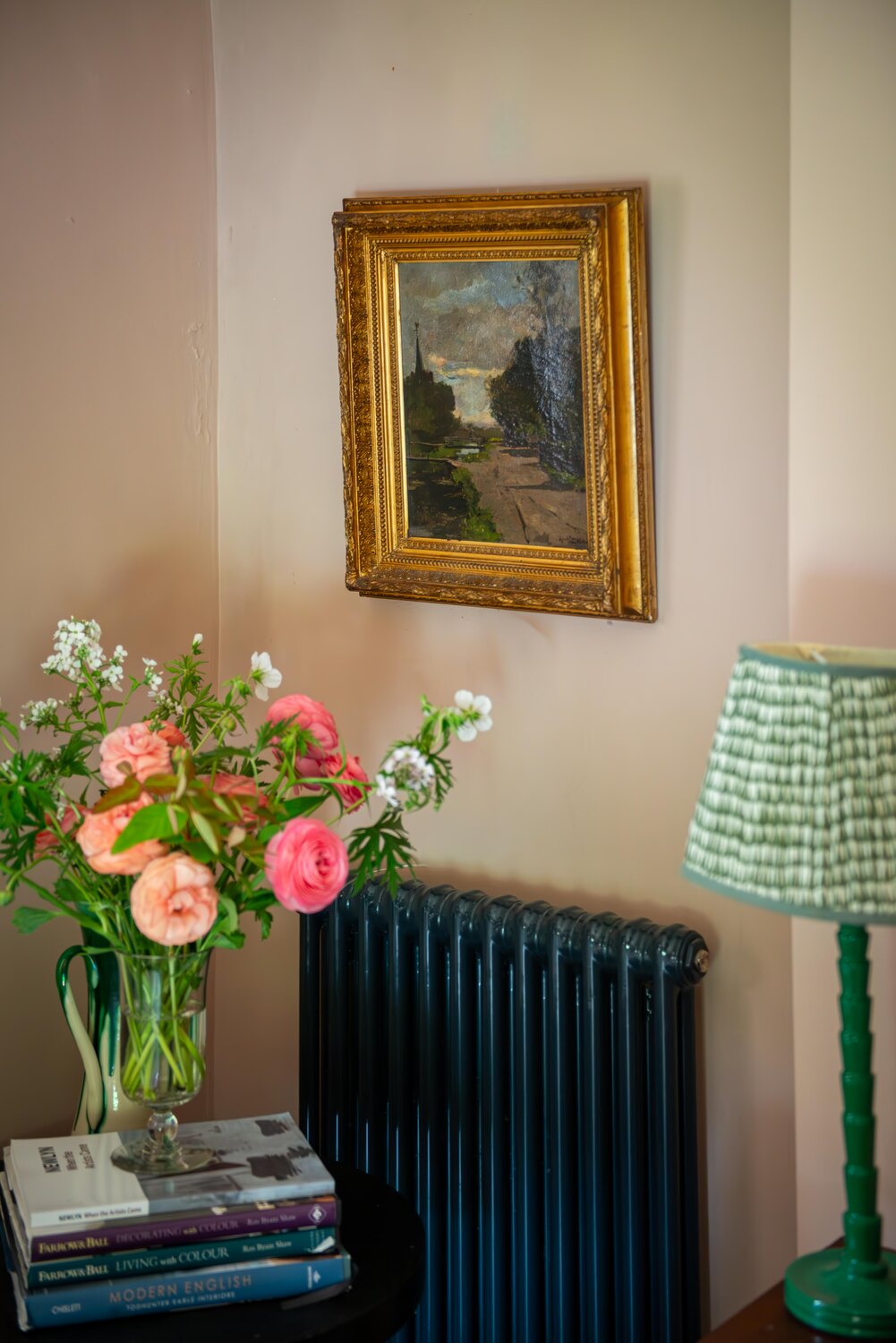 Impressionist artwork hung in an interior setting