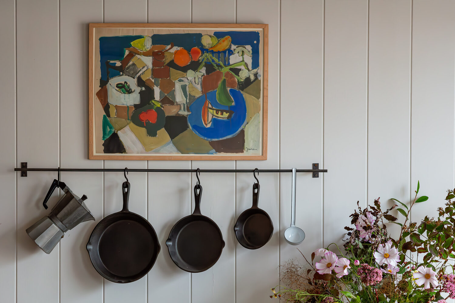 Summer artwork hung in an interior setting