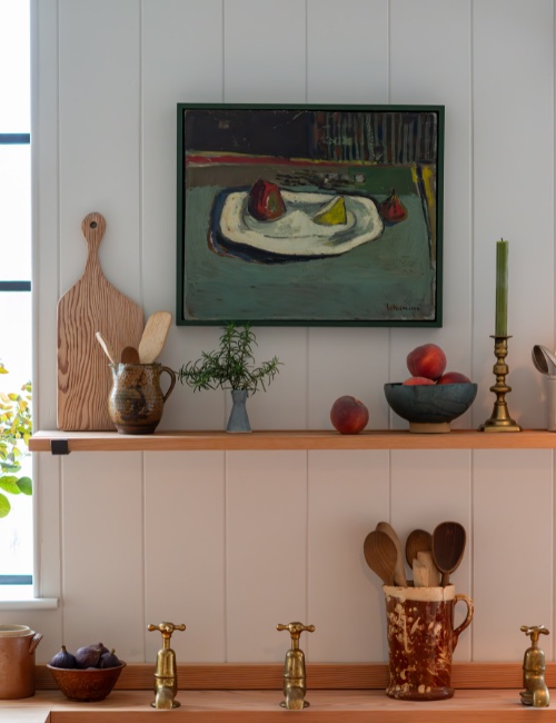 Kitchen interior with artwork on wall